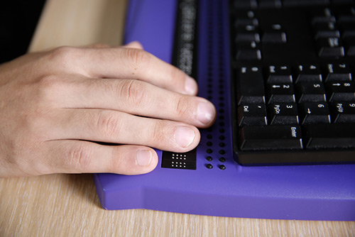 Person using a braille display